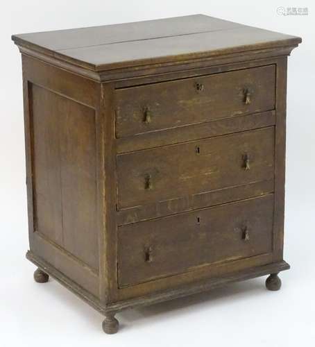 An 18thC oak chest with a moulded top above three long drawers with drop handles and the chest