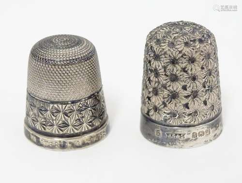 Two silver thimbles, one marked Sterling, the other hallmarked Birmingham 1923 maker James Swann &