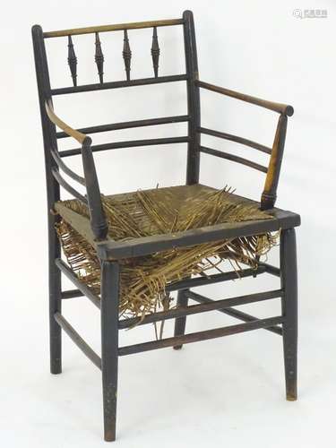 A late 19thC Arts and Crafts Sussex chairs designed by Morris & Co, with turned supports and