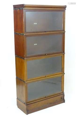 An early / mid 20thC mahogany Globe Wernicke bookcase with four tiers having sliding glass doors.