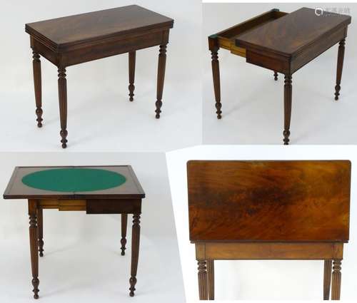 A late Georgian mahogany folding card table, having a moulded rectangular top above four reeded