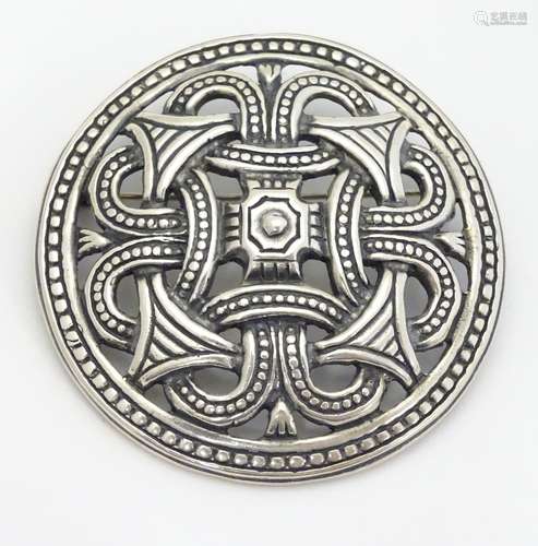 A Scandinavian .925 silver brooch / pendant of circular form with Celtic / Viking decoration