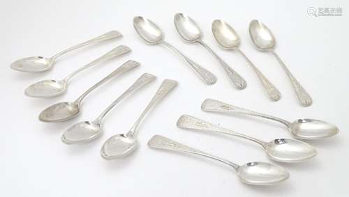 A set of 12 Victorian Scottish silver teaspoons with chased and engraved decoration, hallmarked