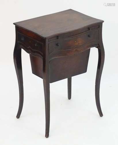 A late 18thC mahogany work table attributed to George Hepplewhite, with a serpentine shaped front