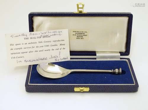 A silver seal top spoon hallmarked London 1977 with Silver jubilee mark maker C J Vander Ltd. Approx