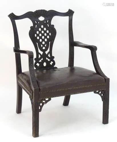 An Irish 19thC mahogany Chinese Chippendale open armchair with carved frame and pierced back