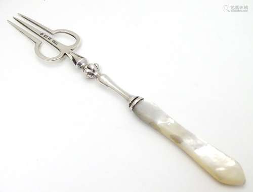 An unusual silver pickle fork with mother of pearl handle, hallmarked Birmingham 1901, maker