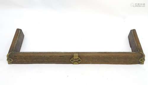 A late 19thC brass fire fender decorated with egg and dart mouldings and pierced decoration. 53