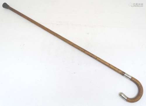 An early-to-mid 20thC bamboo walking stick, with hallmarked silver knop and band, 34 1/2