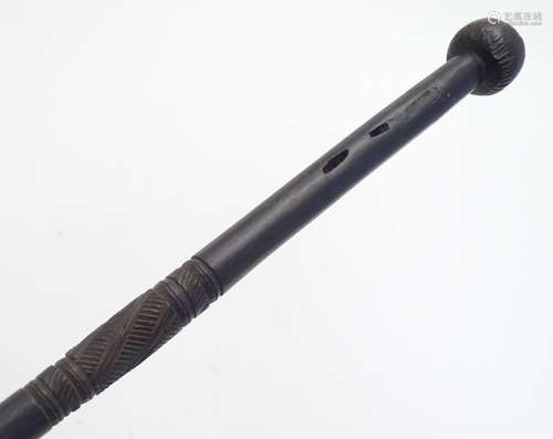 A carved hardwood tribal walking stick / cane, with a carved pommel and carved banded detail to