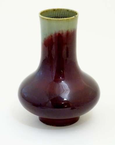 A Chinese sang de boeuf two tone vase with a crackle glaze. Character marks under. 11 1/2'' high.