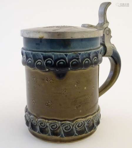 A Rosenthal tankard / beer stein with incised flower decoration to the body, designed by Bjorn