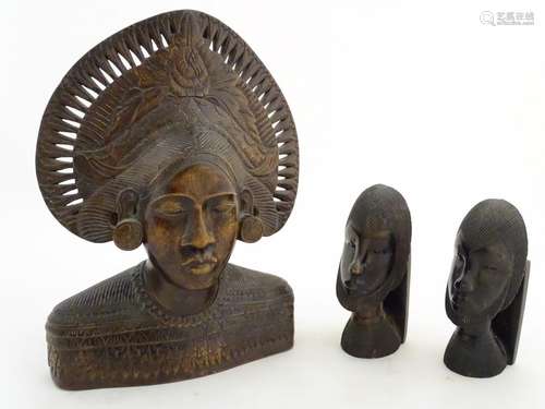 Ethnographic / Native / Tribal: A carved wooden bust of a woman wearing a headdress with incised