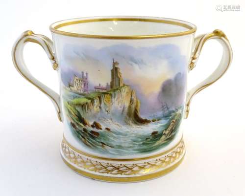 A late 19thC Coalport loving cup decorated with a hand painted coastal scene with a shipwreck by a