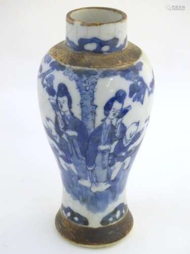 A Chinese blue and white baluster vase depicting figures in a landscape, with incised banded