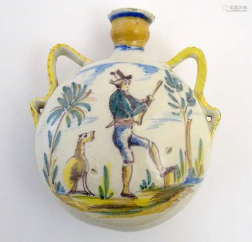 A 19thC Spanish faience pilgrim flask with hand painted decoration depicting a hunting scene and a