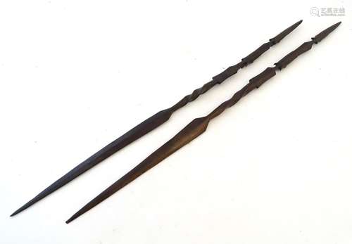 Native Tribal : 2 mid 20th C African carved hard wood spears each with 2 African mask motifs approx.