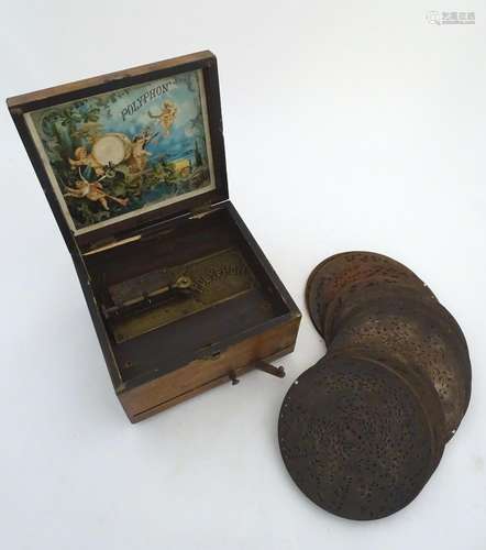 A late-19thC Polyphon clockwork disc player music box, with interior label for W. E. Barry,