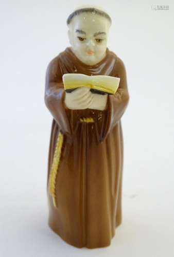 A Royal Worcester figural candle snuffer modelled as a Franciscan monk. Marked within. Approx. 5