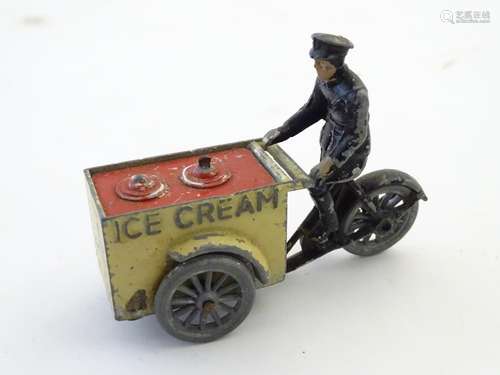 Toy: An early 20thC diecast model of an ice cream vendor and cart / tricycle. Approx. 2 1/2