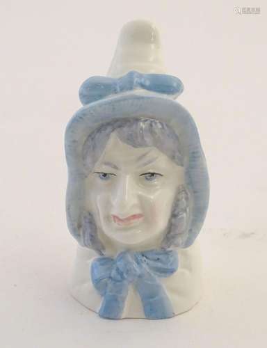 A Royal Worcester figural candle snuffer modelled as Mrs Caudle. Marked within. Approx. 2 3/4