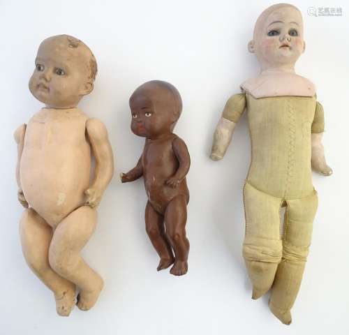 Toys: Three early c1900 dolls, to include an Ernst Heubach doll with a bisque head and shoulders and