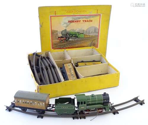 Toys: A boxed Hornby Gauge O clockwork train set, the Aberdonian L.N.E.R., with track, engine and