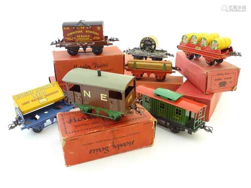 Toys: Seven Hornby Series Gauge O carriages to include Caboose, Side Tipping Wagon, no. 1