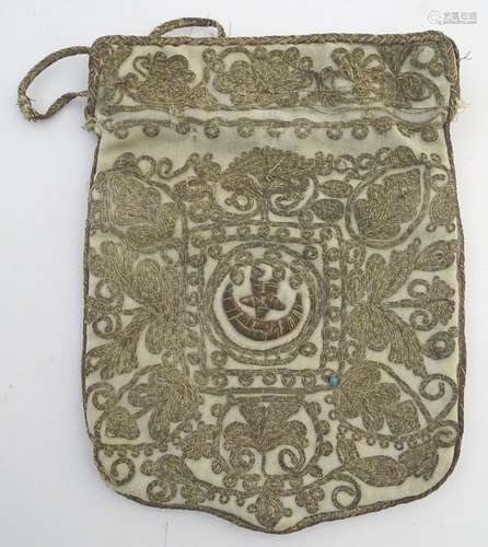 A Turkish drawstring bag / pouch decorated with a scrolling foliage design in gold thread with the