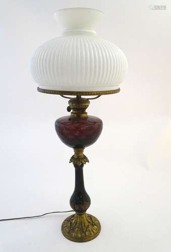 Lighting: a late-19thC table oil lamp (converted to electricity), the lobed milk glass shade