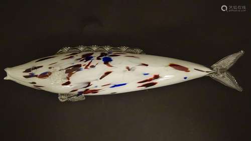 A Murano glass model of a fish, decorated in white with red and blue flecks. 18 1/4