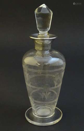 Glass: a silver collared glass scent bottle with etched floral decoration and glass stopper.