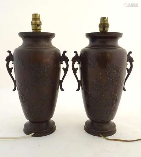 A pair of late-19thC Japanese bronze lamps, with burnished patinated finish, twin handles and