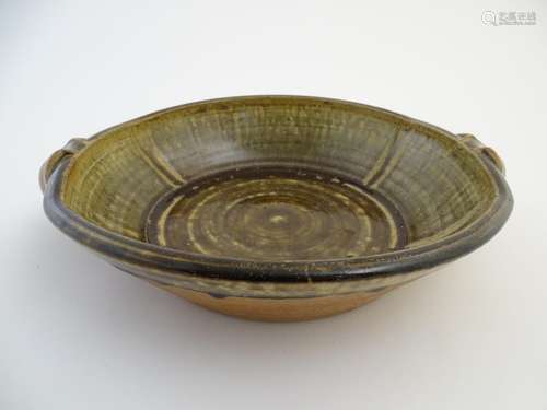 A Roger Cockram studio pottery twin handled bowl. Northcott Pottery mark to side. Approx. 13