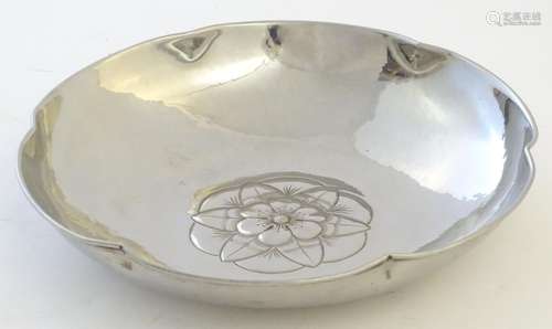 A Keswick School of Industrial Art (KSIA) Firth Staybrite bowl with a lobed rim, hammered decoration