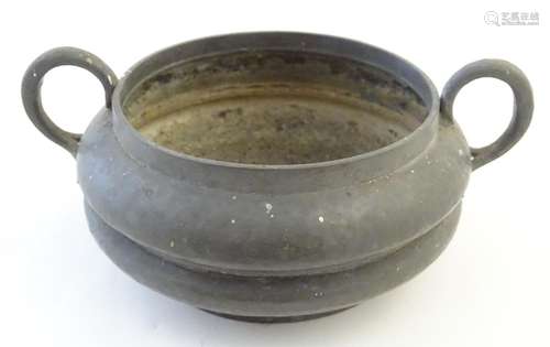 A Tudric pewter twin handled bowl with a waisted body. Marked under, no. 0488. Approx. 2 3/4