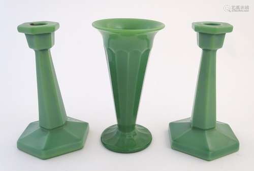 Glass: an Art Deco green opaque glass mantle set, comprising vase and two candlesticks (each 7 3/