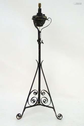 Lighting: a late-Victorian wrought iron standard lamp (converted to electricity) with black