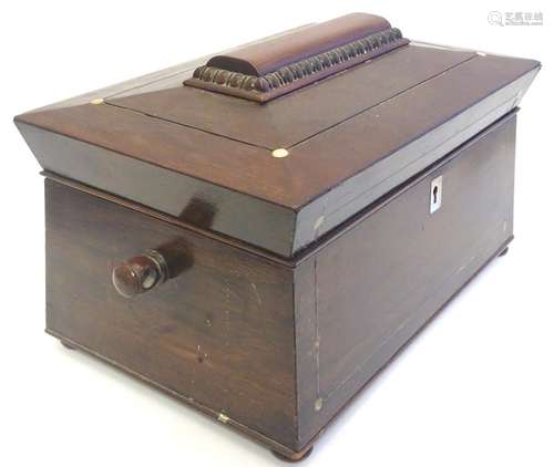 A 19thC mahogany three sectional tea caddy of sarcophagus form, with inlaid mother of pearl