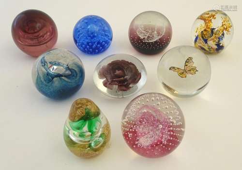 Glass: a collection of Victorian and later art glass paperweights, comprising three examples by