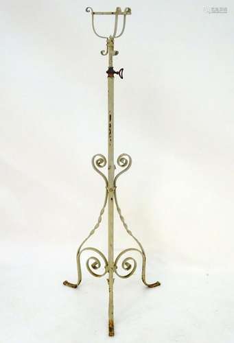 Lighting: a late-Victorian wrought iron and copper lamp stand, with white painted finish,