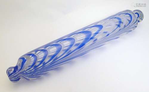 A 19thC Nailsea glass rolling pin, with knop handles, decorated with blue and white detail. 16 1/