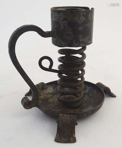 A late 19thC Continental wrought iron spiral candlestick, marked under Josef Schmirler, Wien /