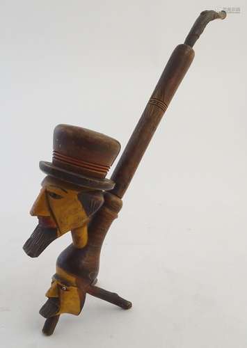 An early 20thC Bavarian/Black Forest novelty figural smoking pipe, of sectional carved and turned