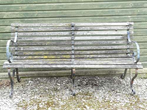 Garden & Architectural, Salvage: an early-to-mid 20thC cast iron and slatted wooden garden bench,