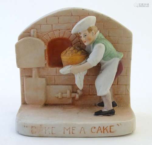 An English flatback fairing depicting a baker and his oven in relief, with caption 'Bake me a Cake'.