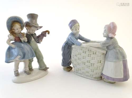 A Carl Scheidig German figural group depicting a boy and girl on an oval base, marked under.