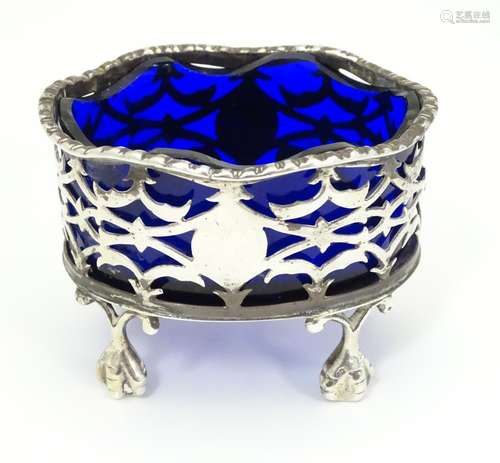 A silver salt with blue glass liner. Hallmarked London 1900 maker Sibray Hall & Co Ltd. 2 1/2