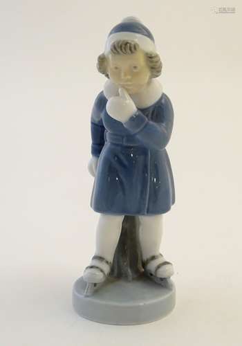 A Royal Copenhagen figure of a girl ice skating, model no. 4523, designed by Hans H. Hansen.