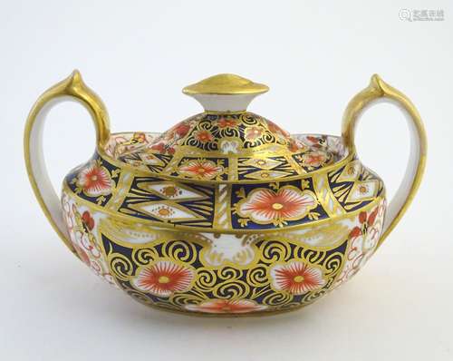 A Royal Crown Derby Imari style twin handled sucrier / sugar bowl and cover, model no. 2451.